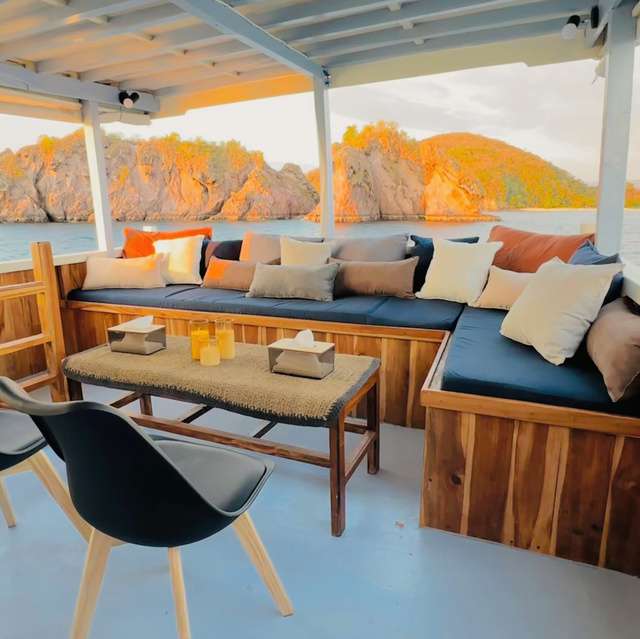 New Pandawa upper deck seating area at sunset over the ocean
