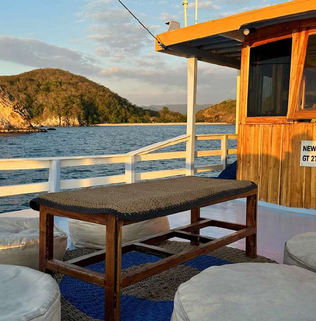 Outdoor lounge on New Pandawa with cushioned seating and a wooden table