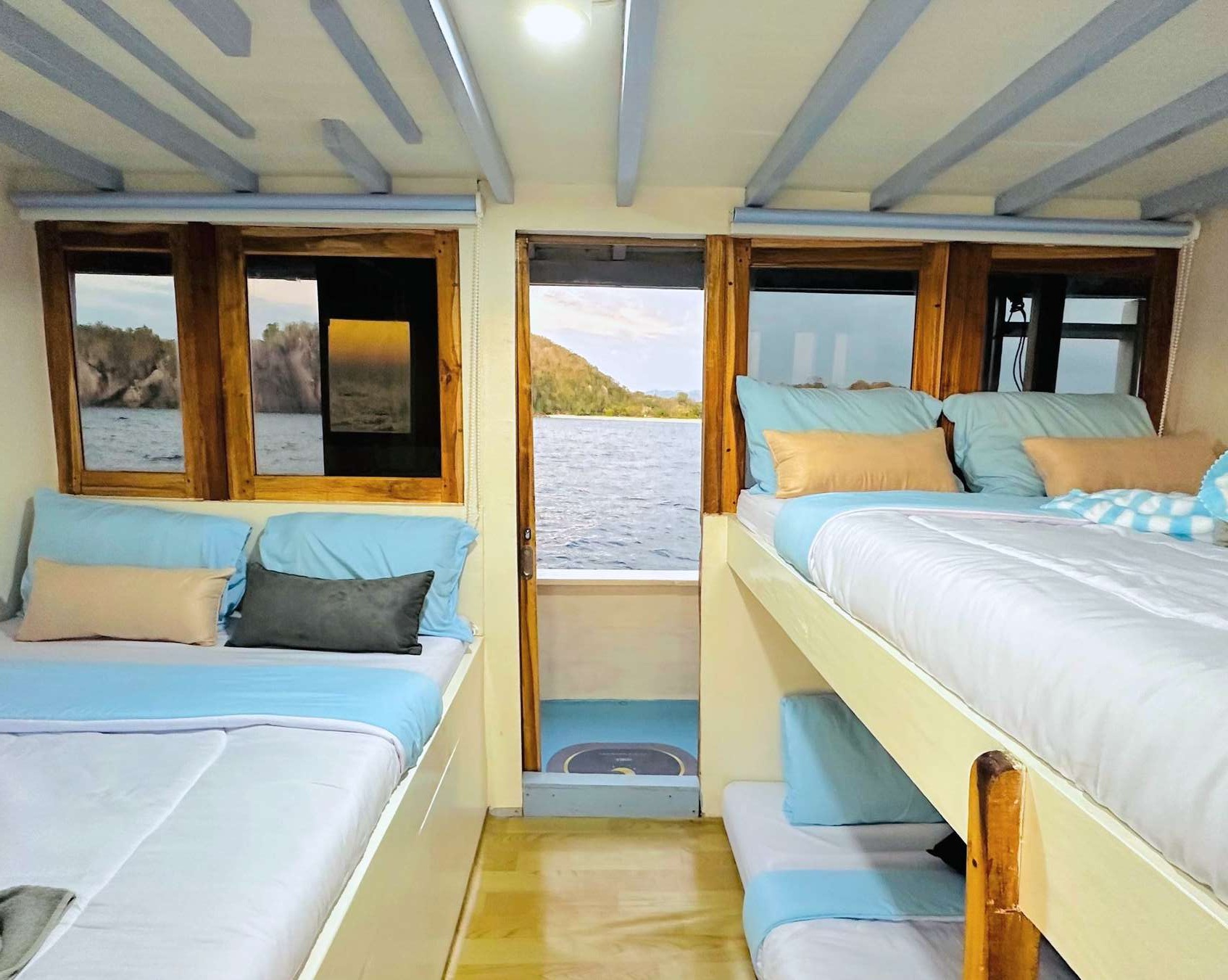 New Pandawa Sharing Room with multiple beds and a shared bathroom on the main deck